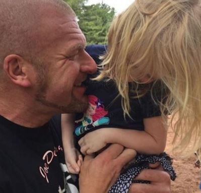 Vaughn Evelyn Levesque with her father Triple H